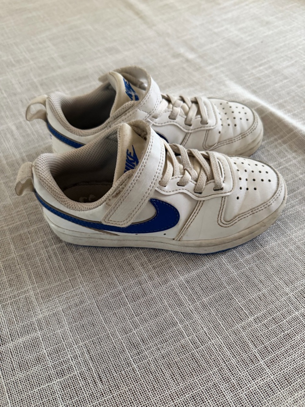 Nike Kids White Sneakers with Blue Swoosh
